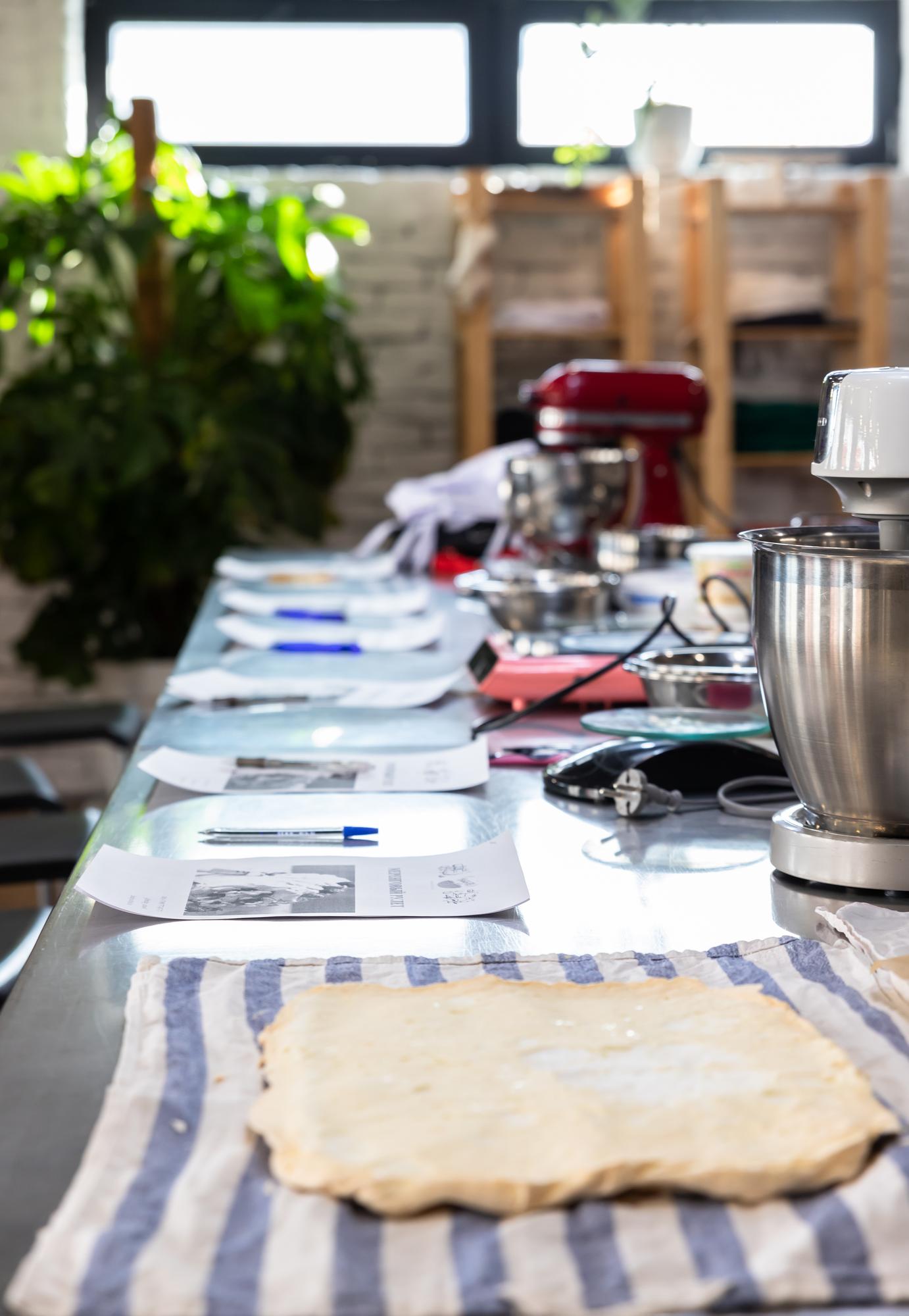 Workshop table with ingredients and tools for pricing section