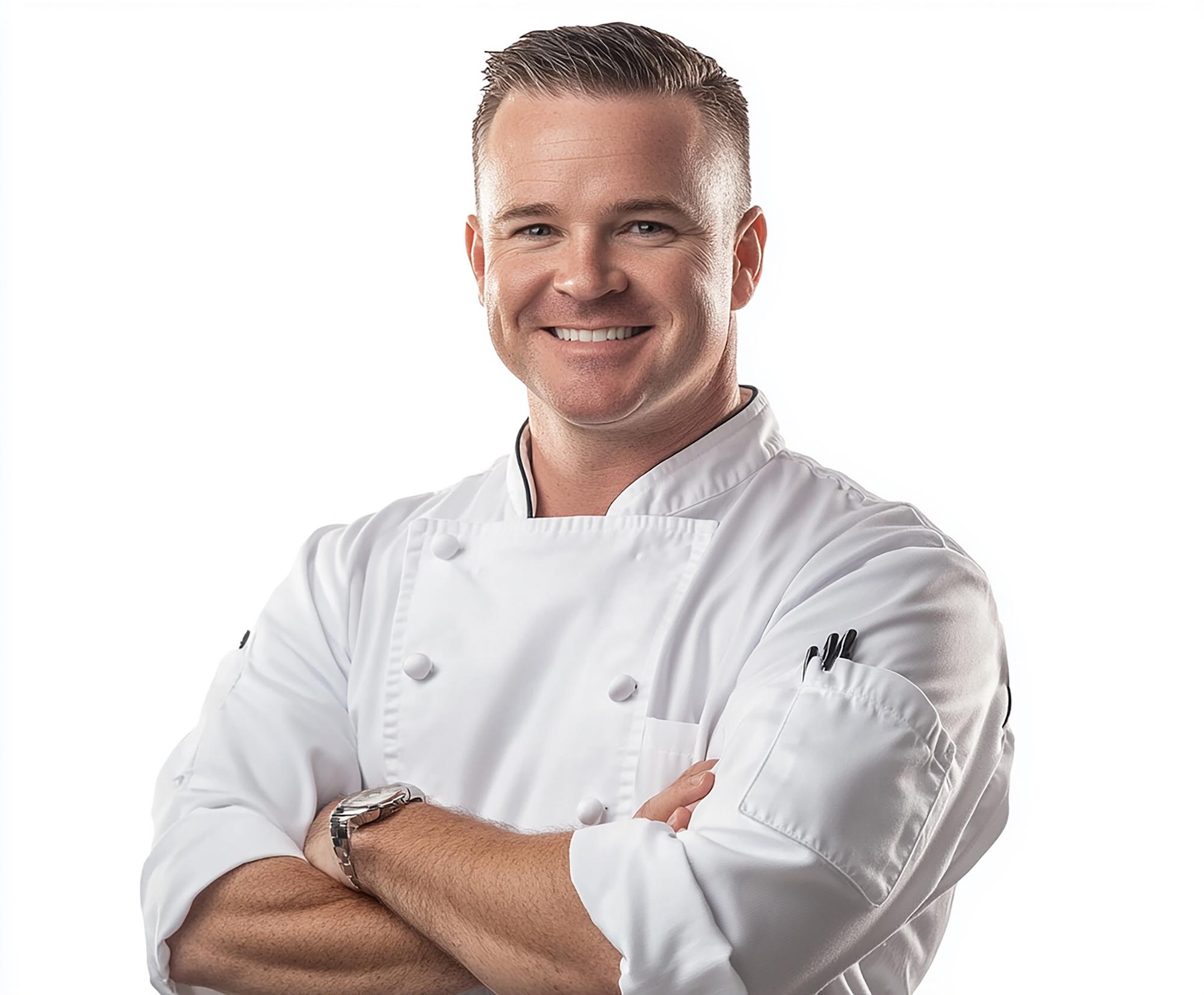 Chef portrait smiling in kitchen